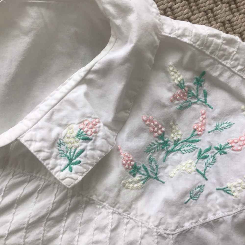 White blouse with embroidered flowers
